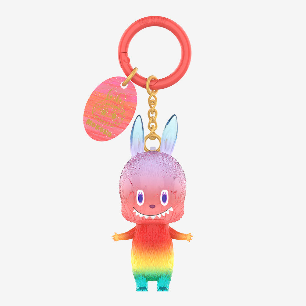 Close-up of a pink Labubu figure with a red keyring from the 10th Anniversary collection