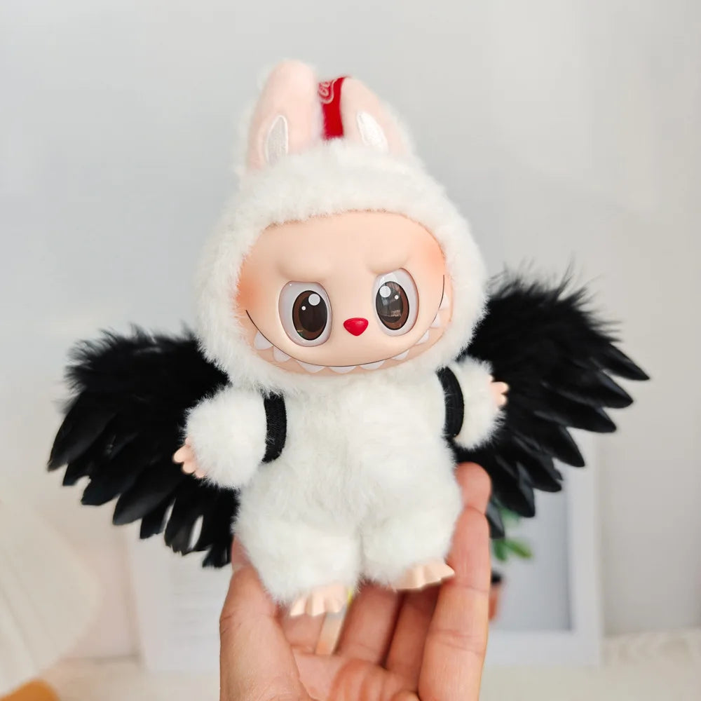 Labubu doll in white Angel Wings plush outfit with black wings