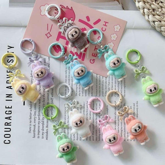 Labubu-style plush keychain bag charms with bow detail, set of four in pastel colours