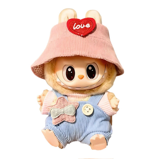 A 17cm vinyl-face Labubu plush doll wearing a custom handmade outfit set featuring a pink bucket hat and matching denim overalls